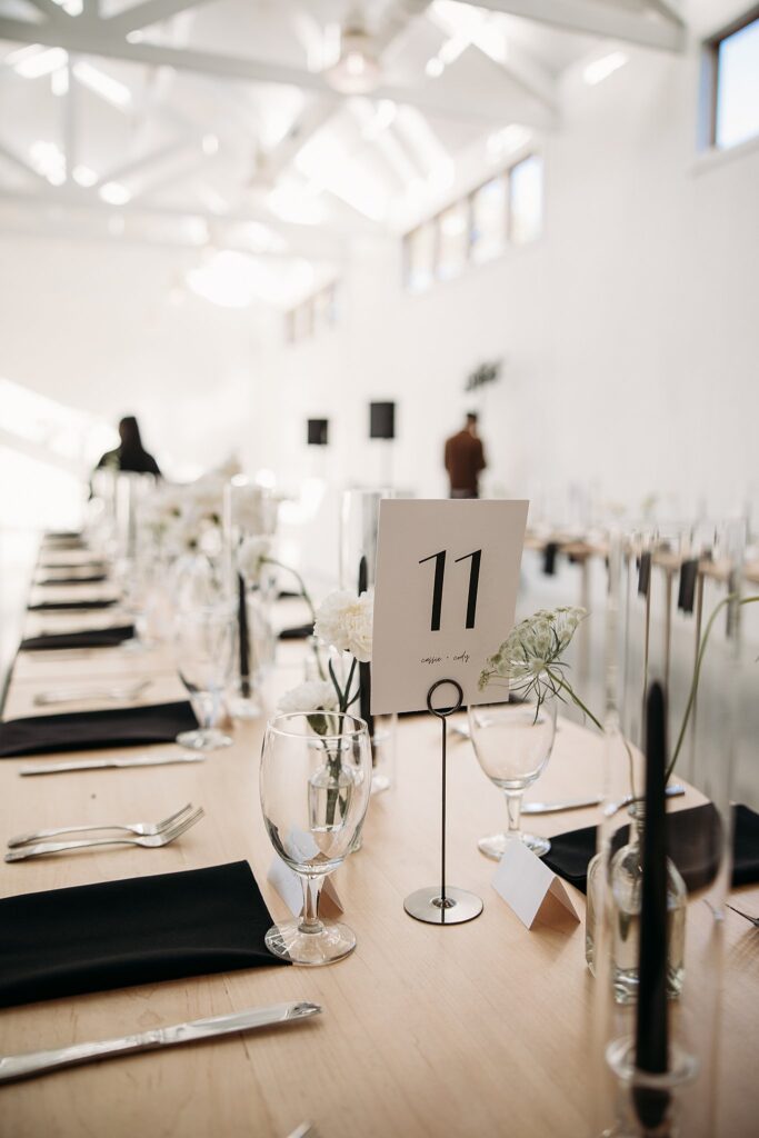 A long table with a number on it at a Wish Well House Wedding.