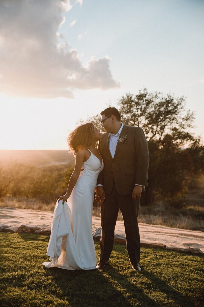 Bride and groom at sunset in the Texas Hill Country wedding venue. 