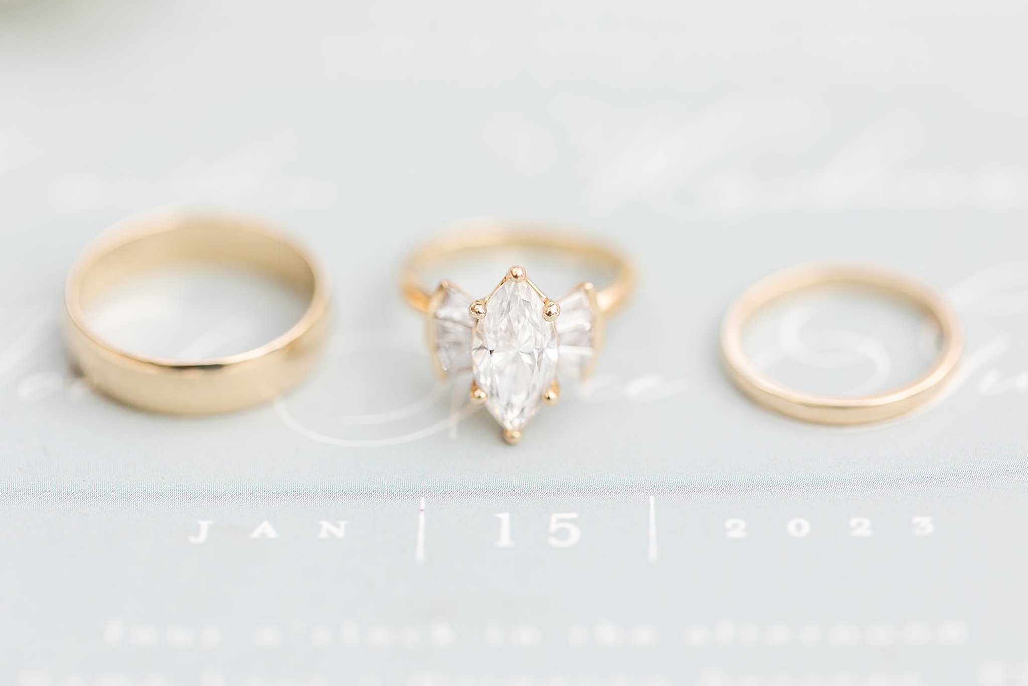 A budget-friendly gold wedding ring with a marquise cut diamond.