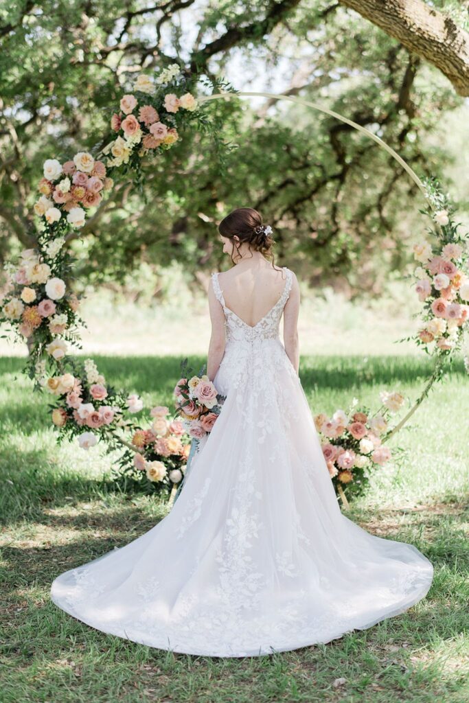 Bride in dress with spring flowers.
