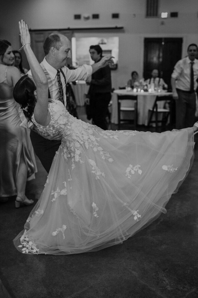 A bride and groom dancing at Pecan Springs Ranch wedding reception.