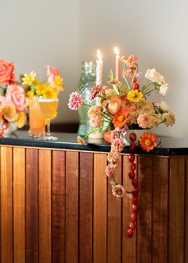 A wooden bar adorned with candles and flowers, creating an enchanting ambiance perfect for a Hotel Magdalena wedding.