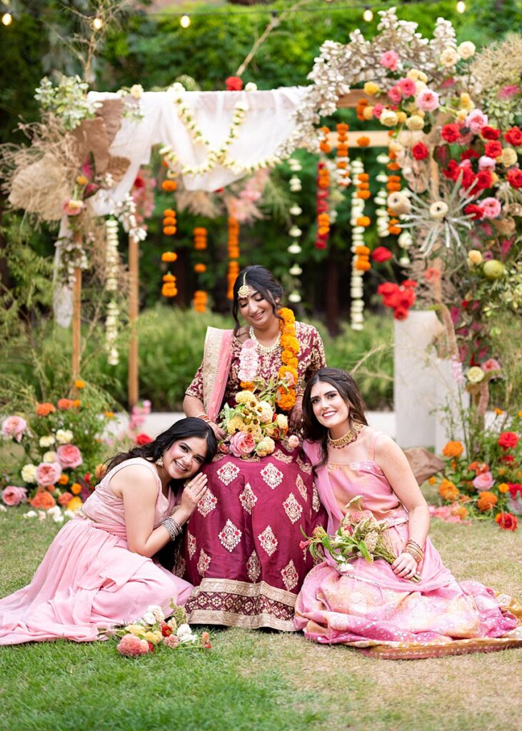 Three Indian brides posing for a photo at Hotel Magdalena Wedding.
