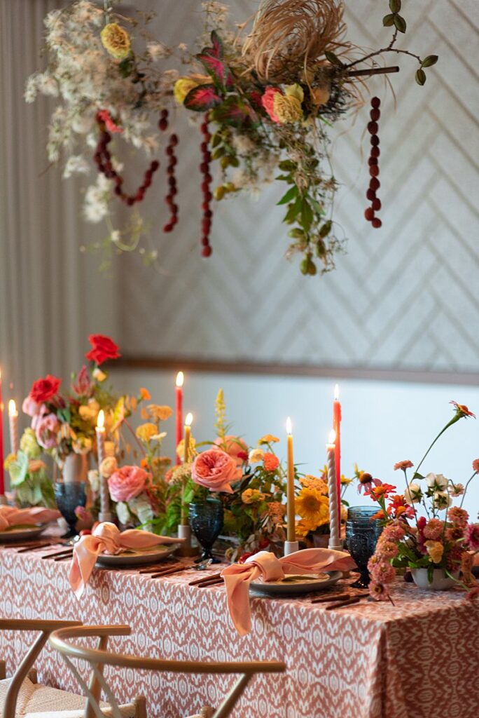 A Hotel Magdalena wedding table set with flowers and candles.