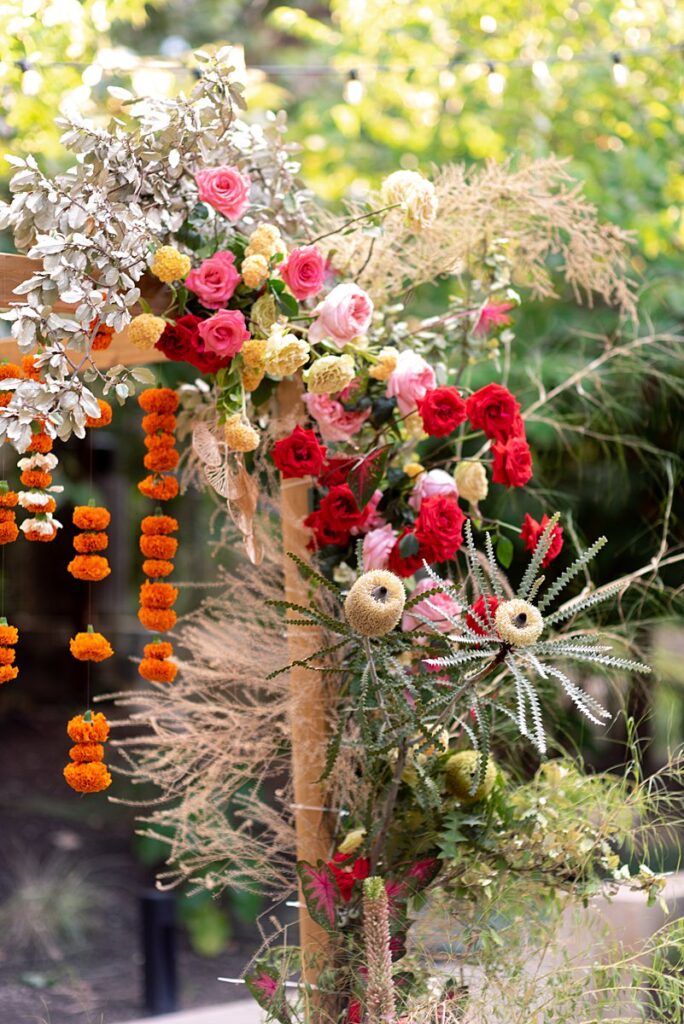 An Indian wedding arch decorated with flowers at Hotel Magdalena Wedding