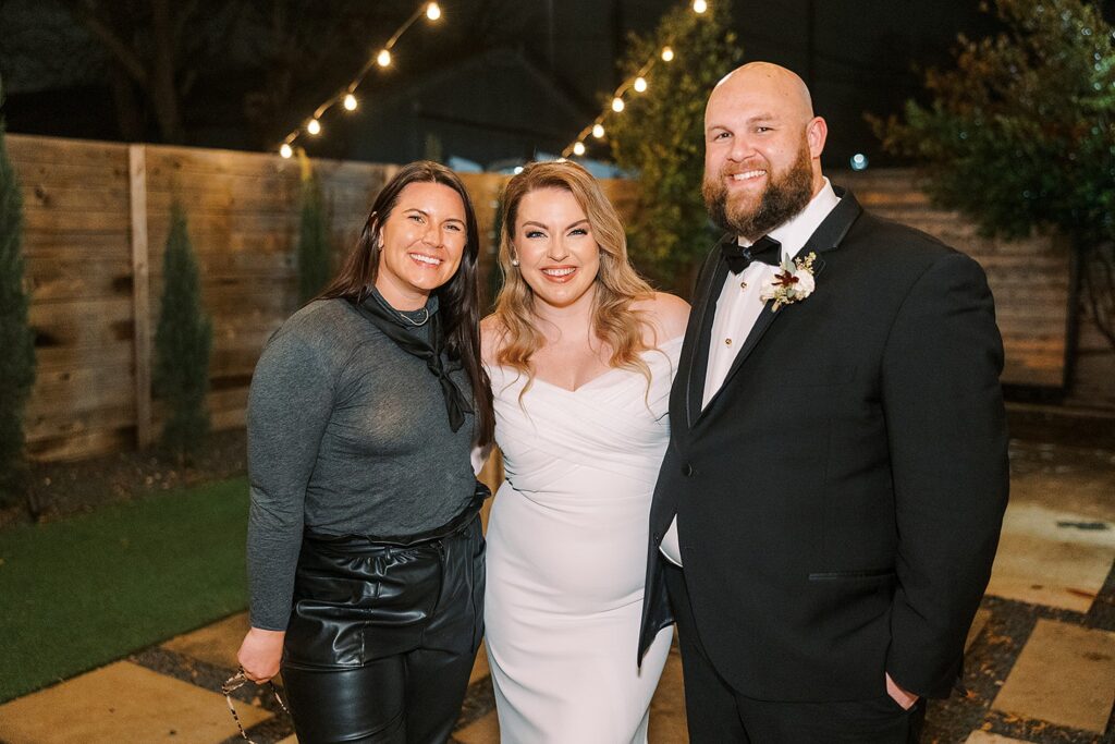 Austin wedding planner at the One Eleven East Wedding Venue with couple. 