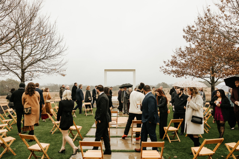 Guests gather for outdoor ceremony during wedding at Prospect House. 