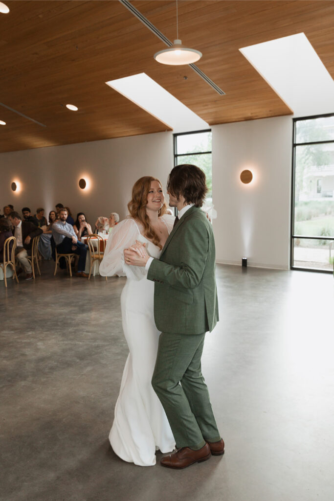 Bride and groom share first dance in the reception hall at The Grand Lady Austin.