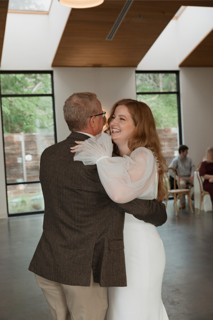 Bride shares dance with father in the reception hall at The Grand Lady Austin.