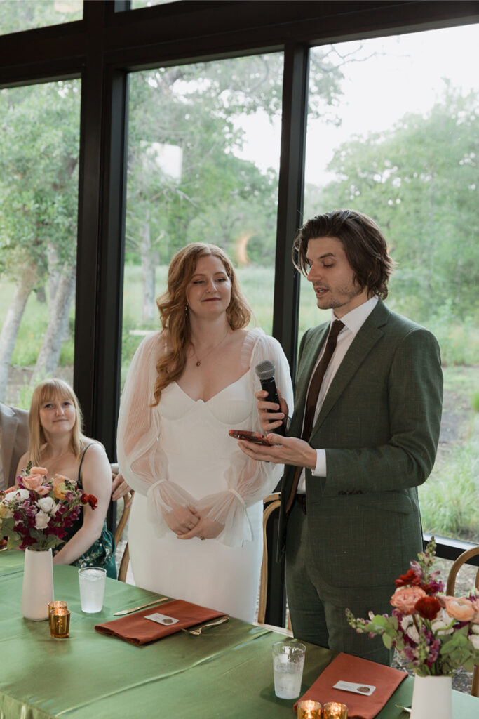 Bride and groom share toast at The Grand Lady Austin. 