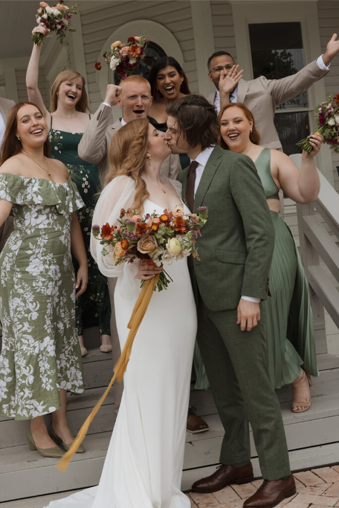 A bridal party take portraits outside of the mansion of The Grand Lady Austin. 