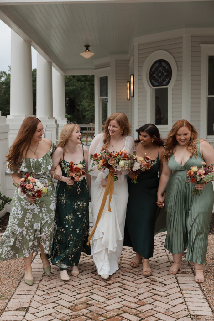 A bridal party take portraits outside of the mansion of The Grand Lady Austin. 