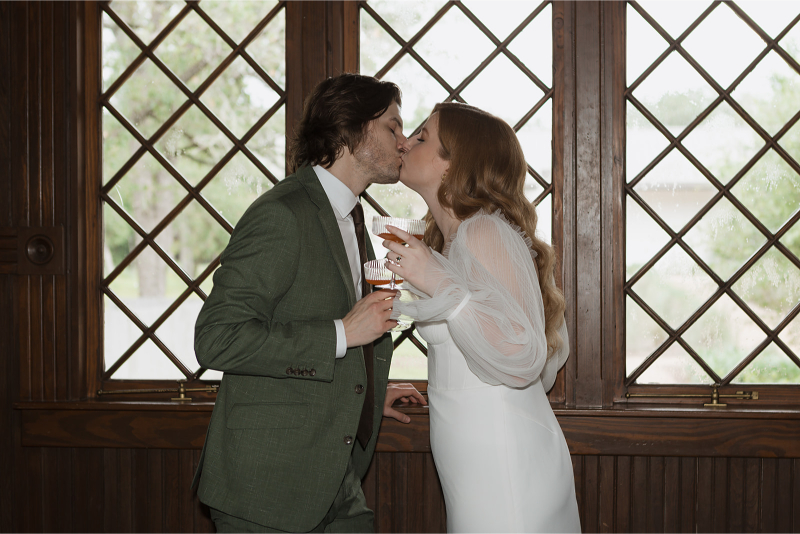 Bride and groom take portraits in the mansion of The Grand Lady Austin. 