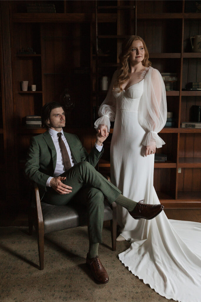 Bride and groom take portraits in the mansion of The Grand Lady Austin. 