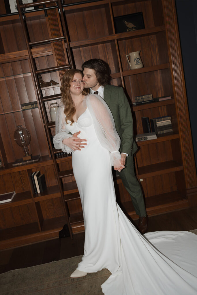 Bride and groom take portraits in the mansion of The Grand Lady Austin. 