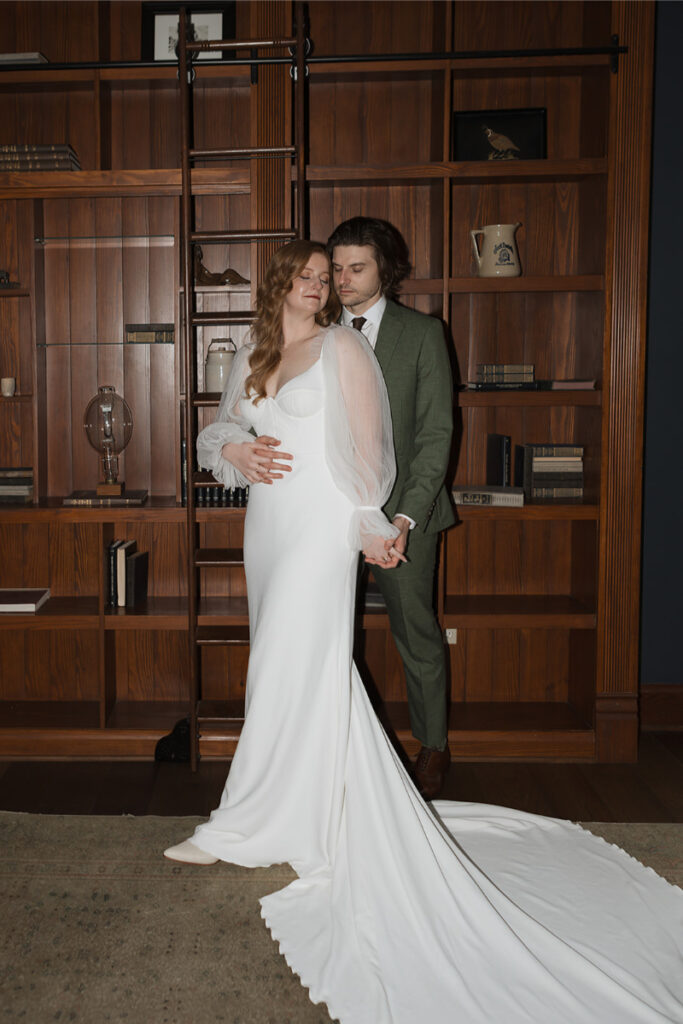 Bride and groom take portraits in the mansion of The Grand Lady Austin. 