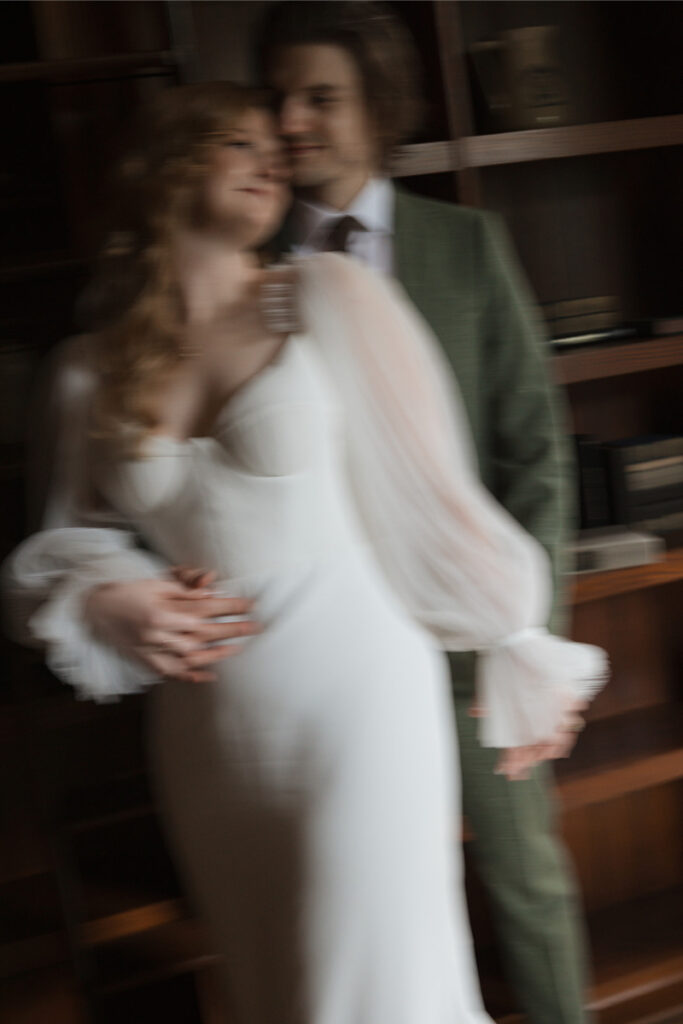 Bride and groom take portraits in the mansion of The Grand Lady Austin. 