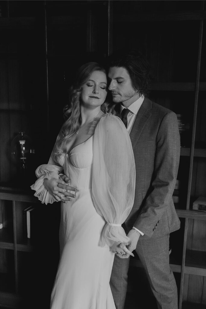 Bride and groom take portraits in the mansion of The Grand Lady Austin. 