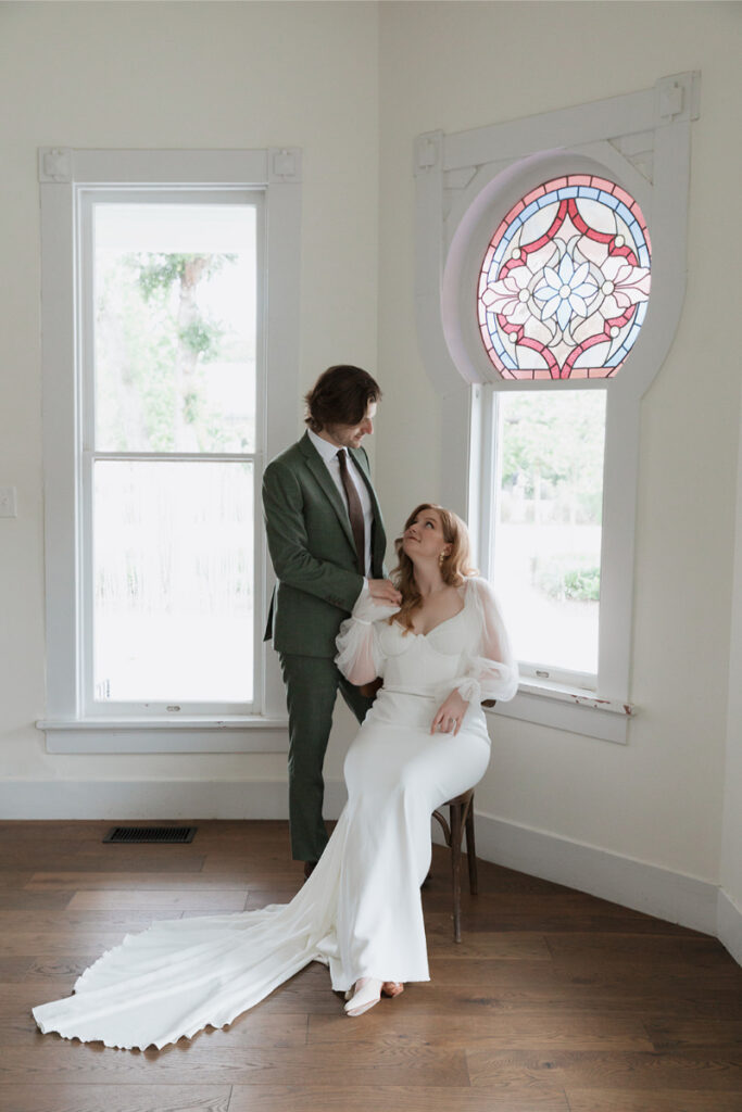 Bride and groom take portraits in the mansion of The Grand Lady Austin. 