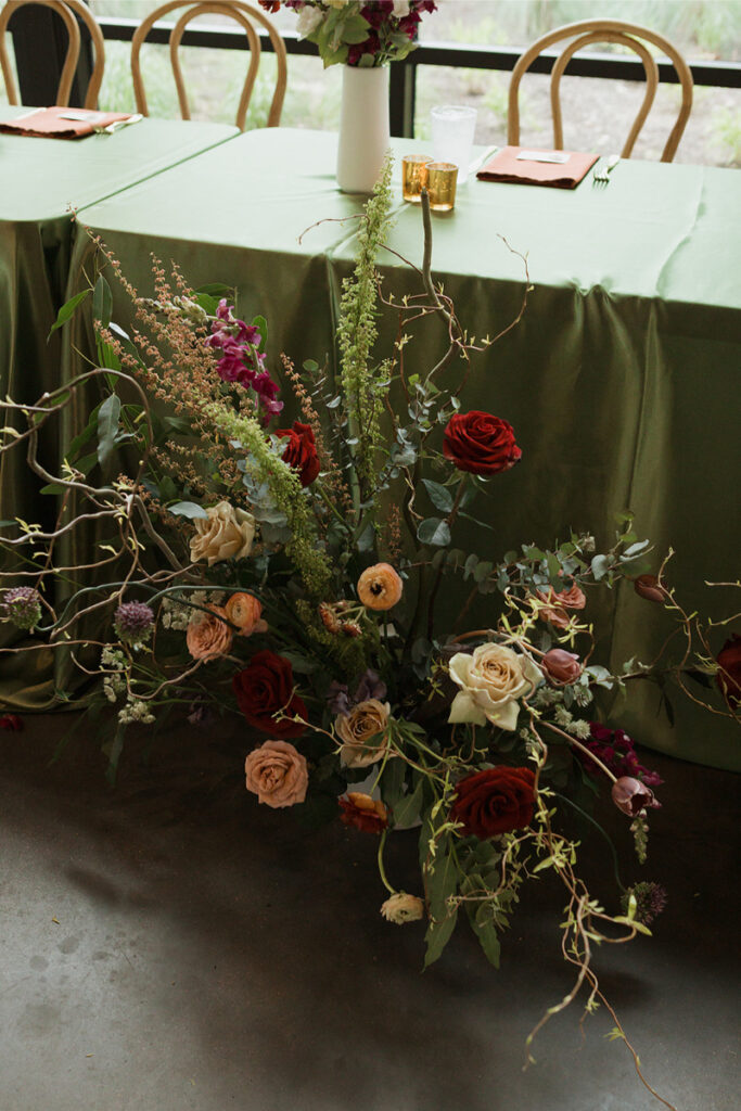 Floral arrangement for a wedding designed by In Ink Weddings.